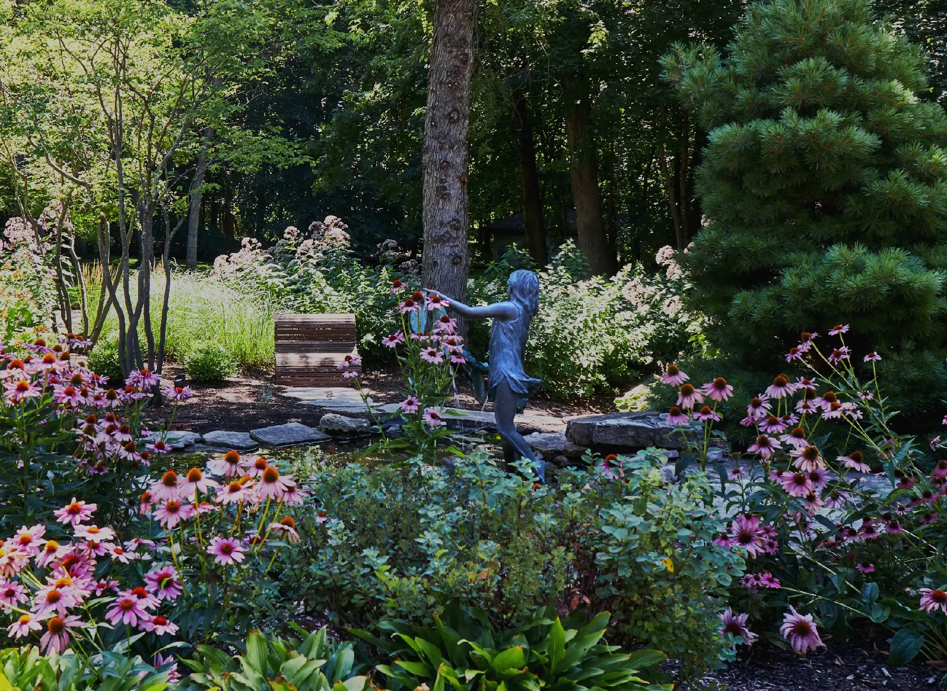 Flower beds with sculpture
