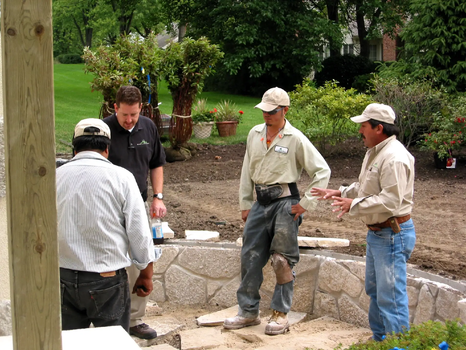 Employees discussing next steps in the patio build