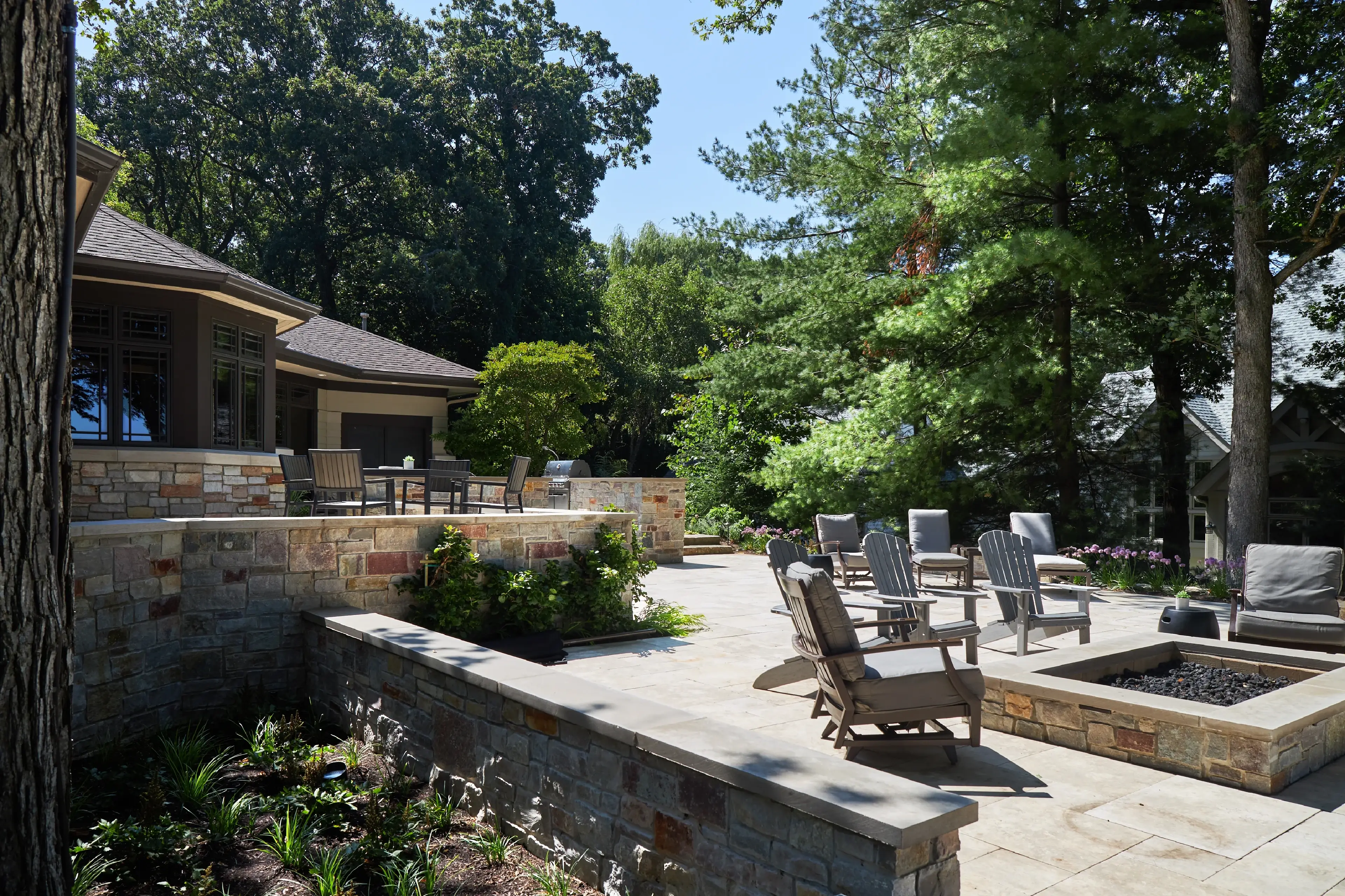 Exquisite patio, stone walls, stone firepit and patio furniture