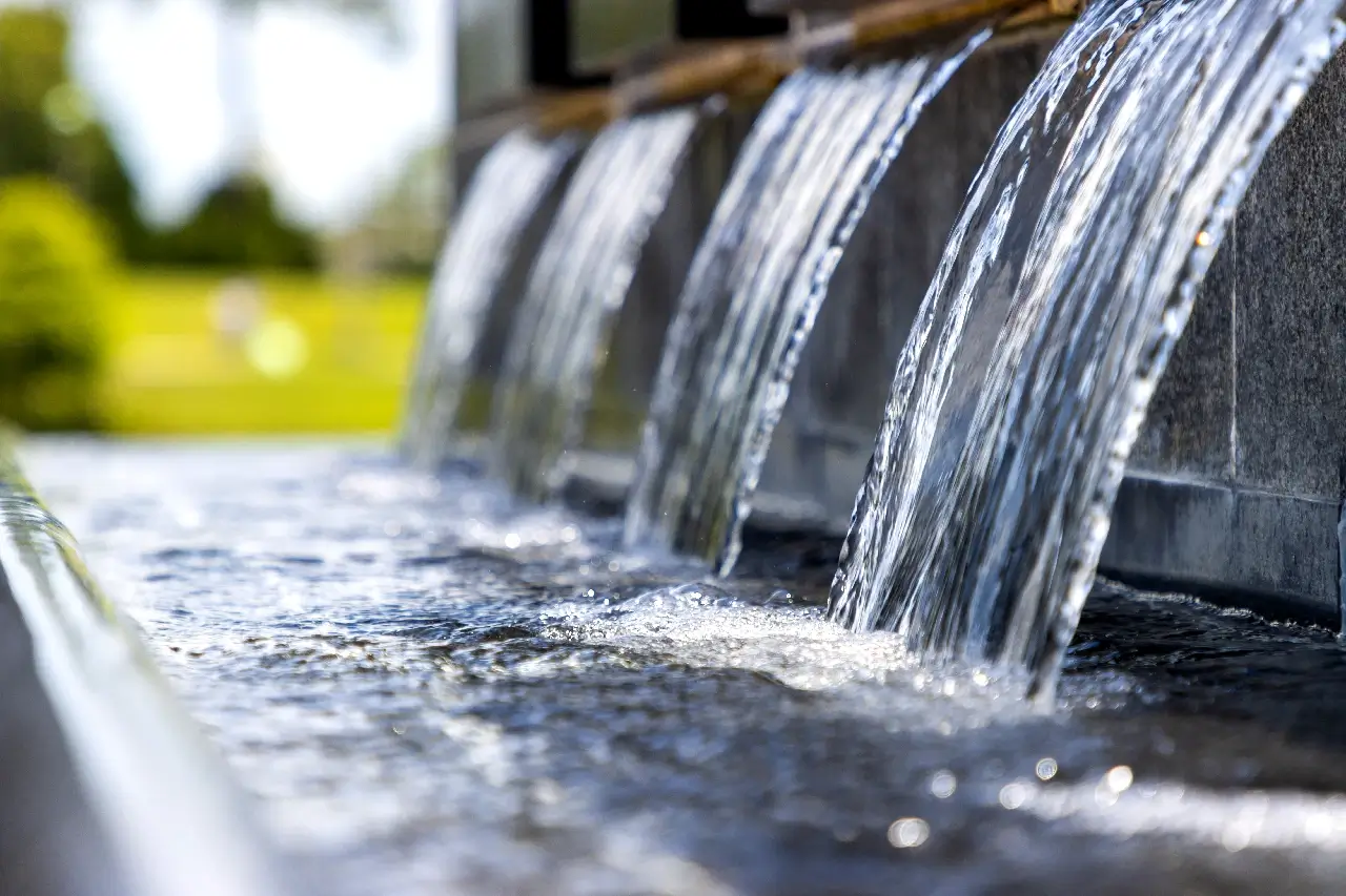 Waterfall feature pouring into basin