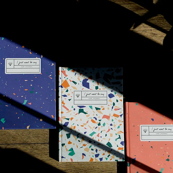 A photo of "I just want to say" vow journals.