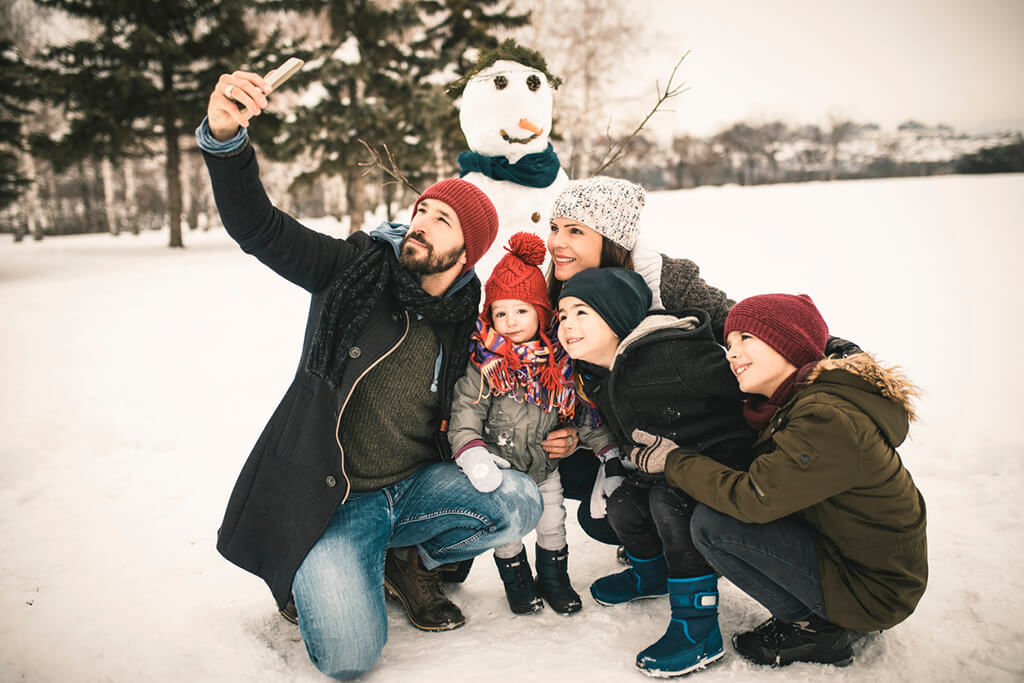 Outdoor Snow Selfie - Stay Warm with FrostGuard Rechargeable Handwarmer