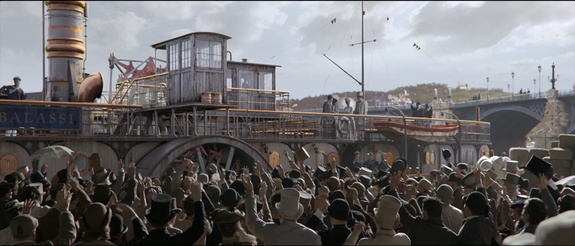 Group of people gathered, waving bye to a steam engine boat and its passengers next to the Margit bridge.