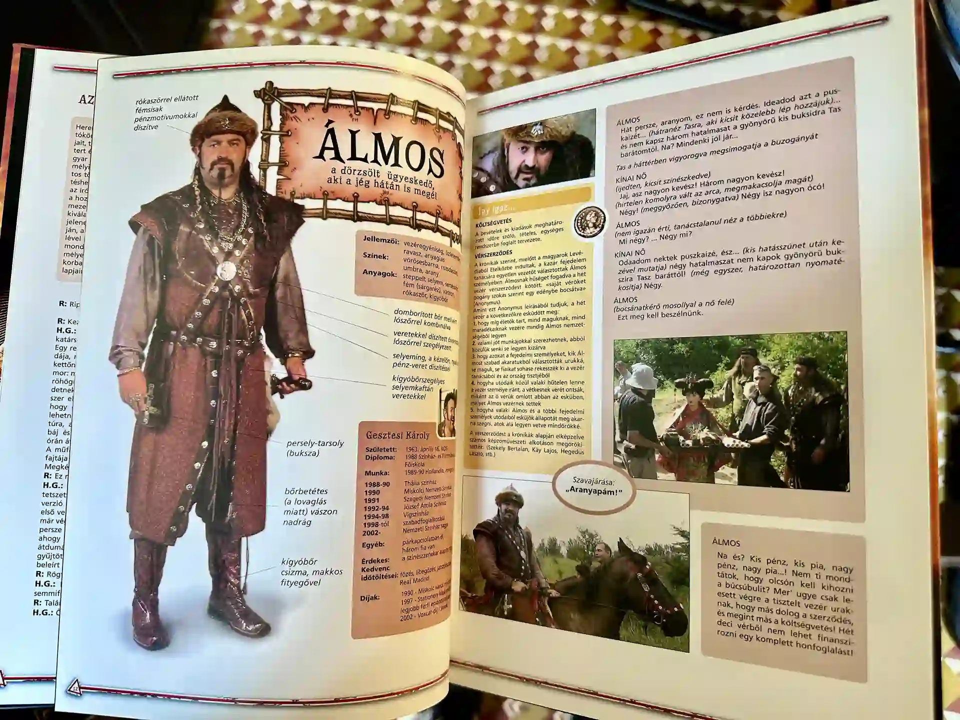 An open book showing a detailed costume page for a warrior character, including a full-body photo in traditional attire and accompanying notes, sketches, and behind-the-scenes production images.