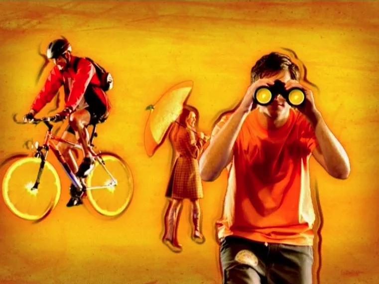 Surreal orange-themed scene with a cyclist on orange-slice wheels, a woman holding an orange umbrella, and a man in an orange shirt looking through binoculars.