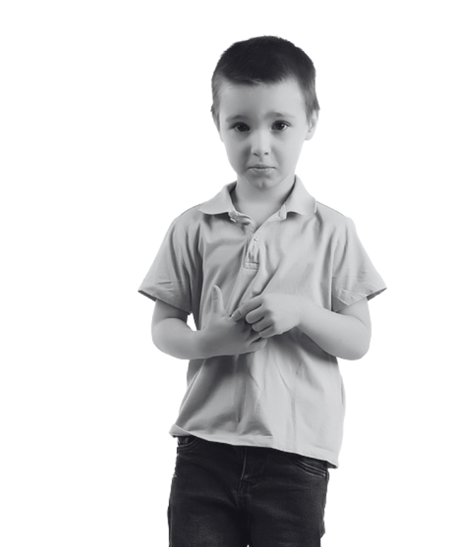 Young boy in a polo shirt looking sad and holding his hands together.