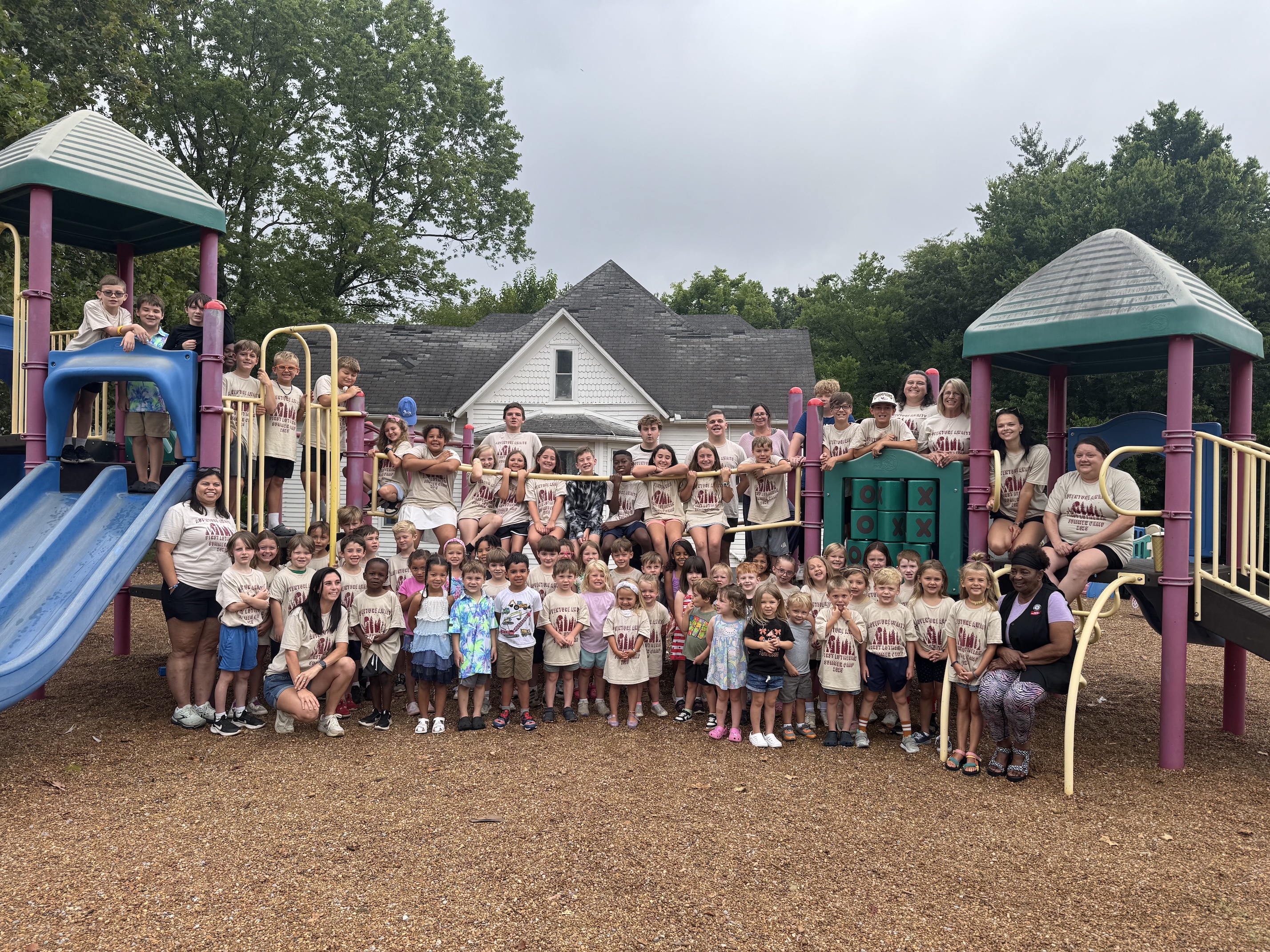 Kids and teachers on the playground for First Lutheran School's summer camp. 