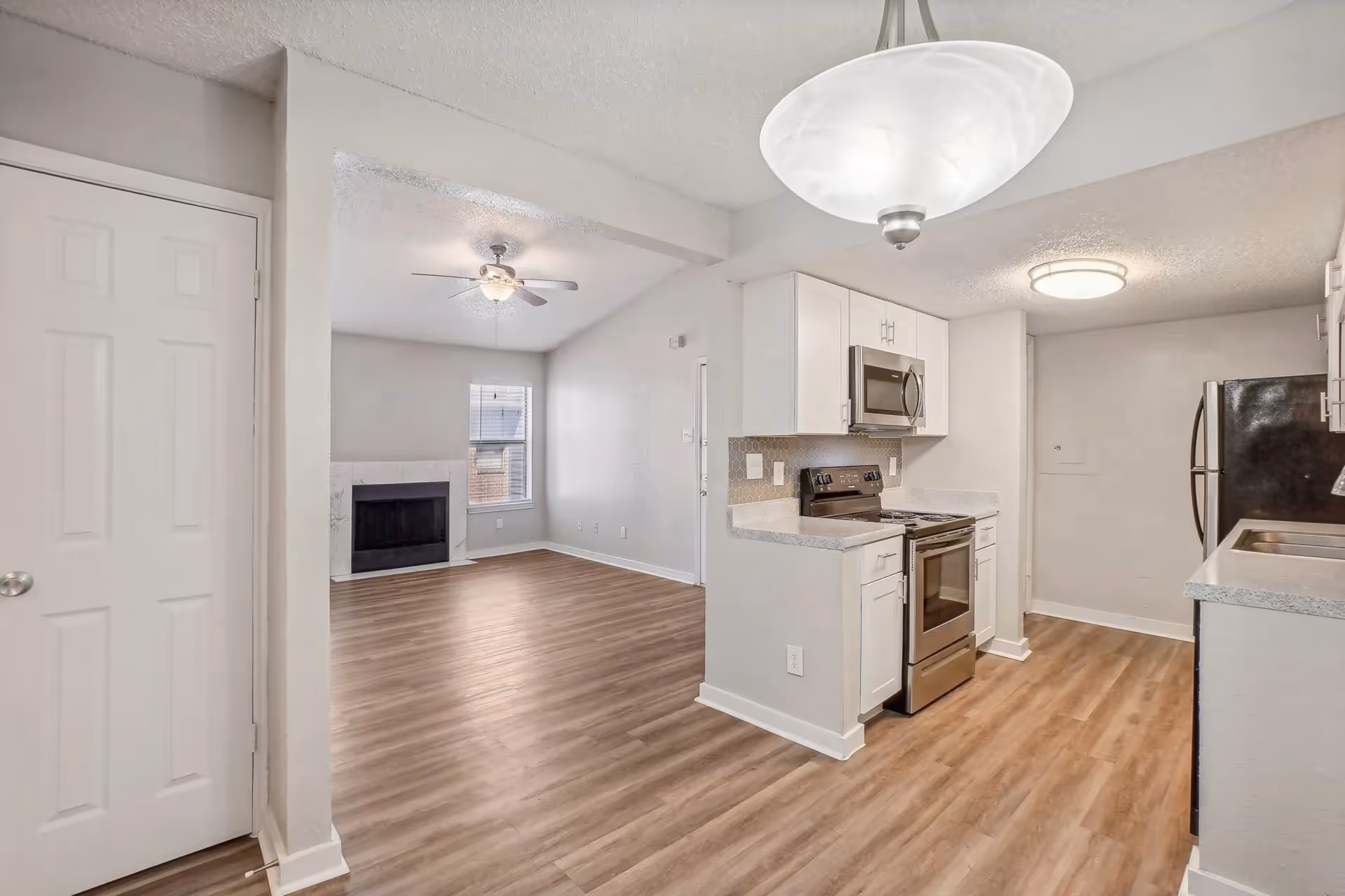 White kitchen with stainless steel appliances