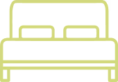 Ícono de cama doble verde con cabeceras y base visibles.
