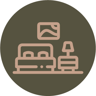 Ícono de habitación con cama, cuadro, mesa de noche y lámpara.