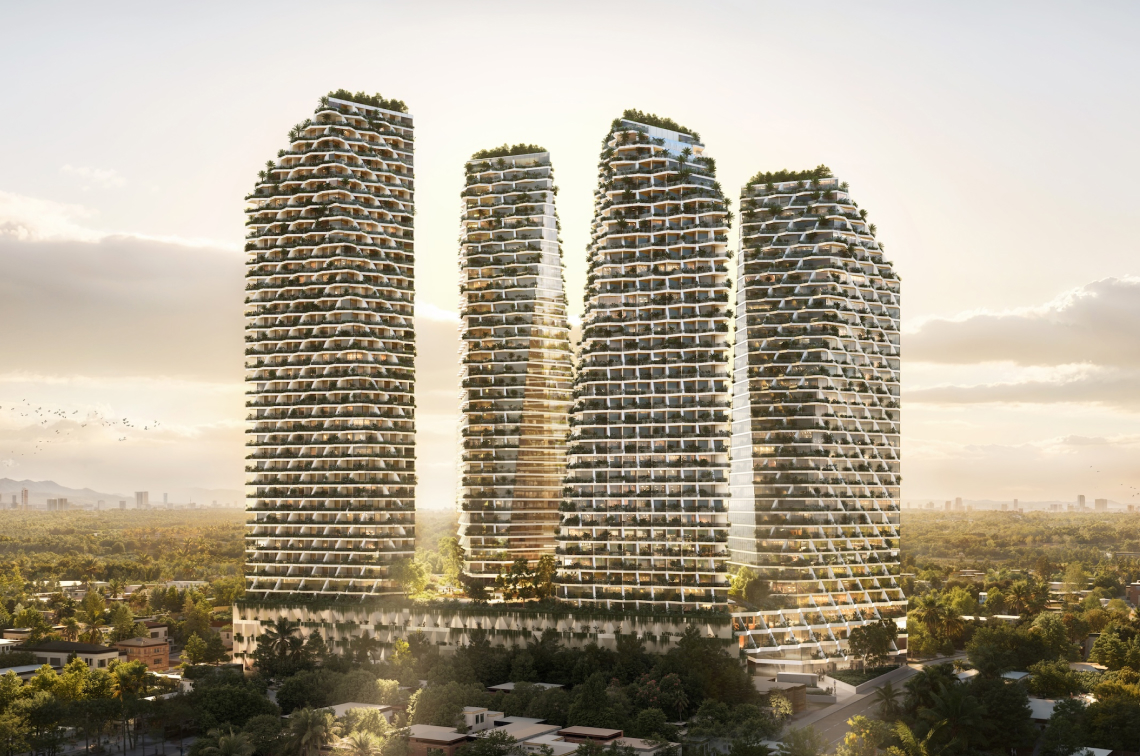 Cuatro torres residenciales modernas con terrazas verdes en un entorno urbano al atardecer.