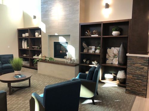 image of workers at machining station (for a manufacturing plant)