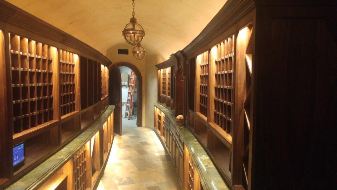 image of workers at machining station (for a manufacturing plant)