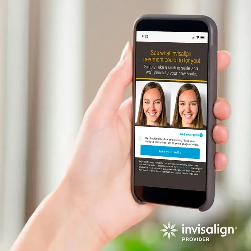 Hand holding phone showing Invisalign smile simulation app with before and after selfies.