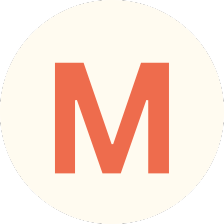 Orange capital letter M centered inside a cream-colored circle.