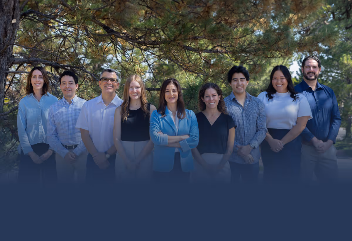 Pamela Garrett and Law Mother team pose for a photo outside