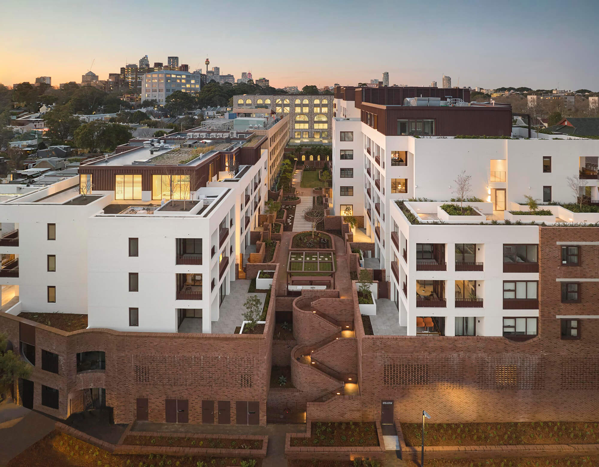 View of a contemporary residential precinct with landscaped courtyards and communal terraces.