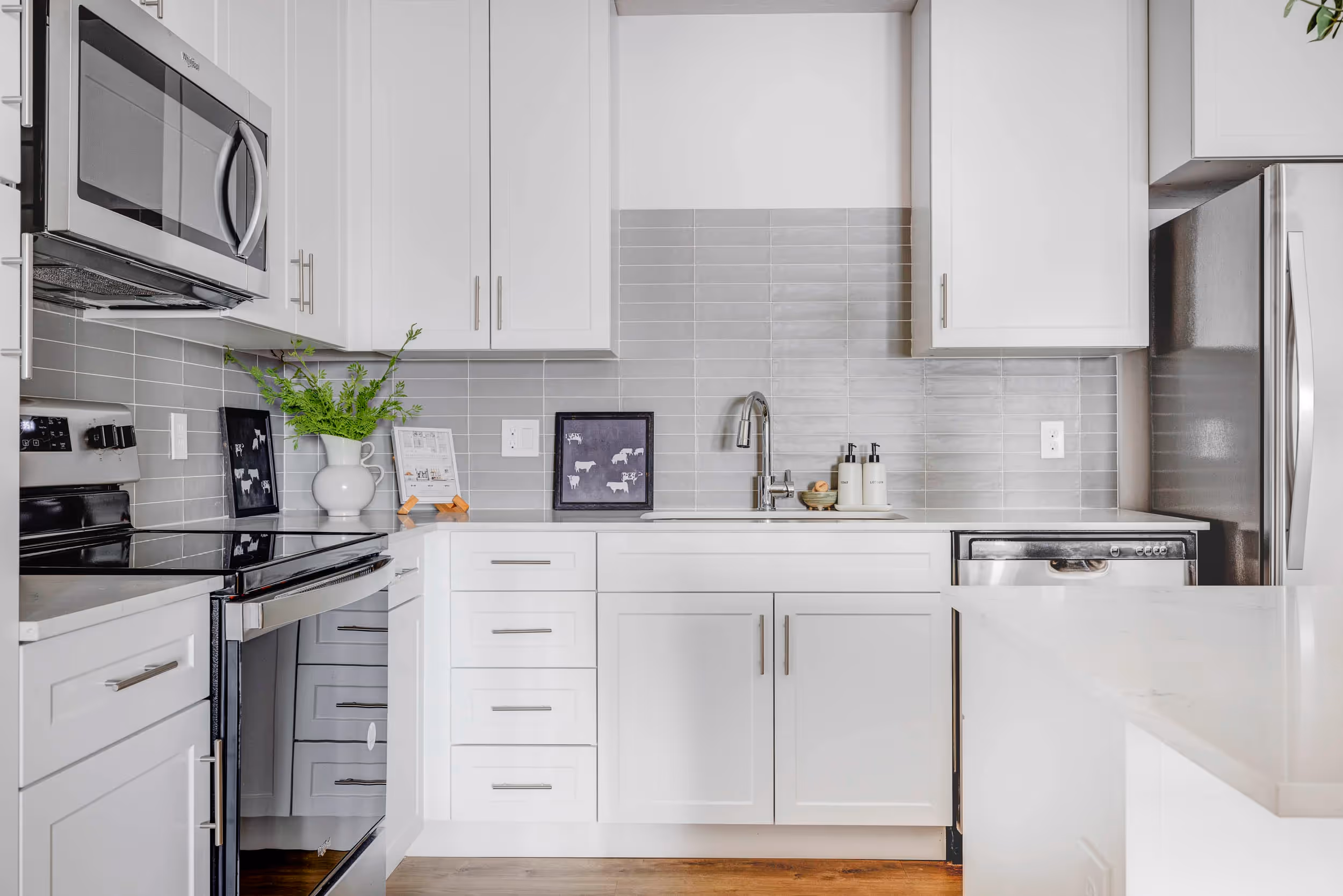 Kitchen with white cabinets and stainless steel appliances