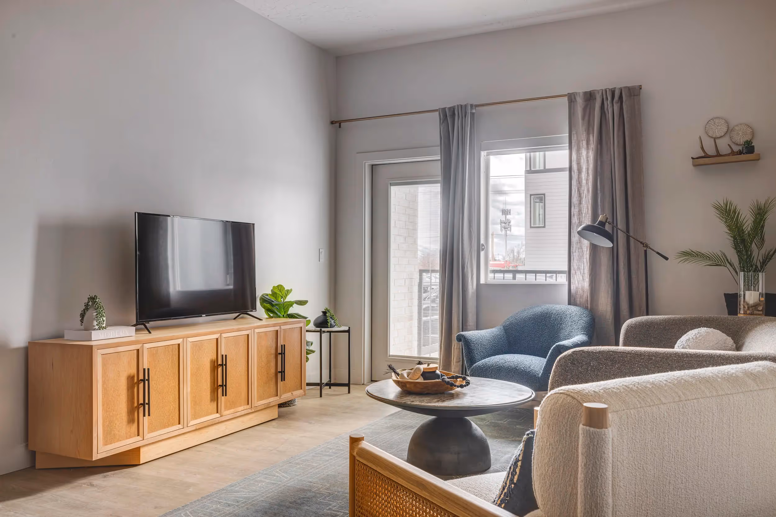 Furnished living room with console table and television