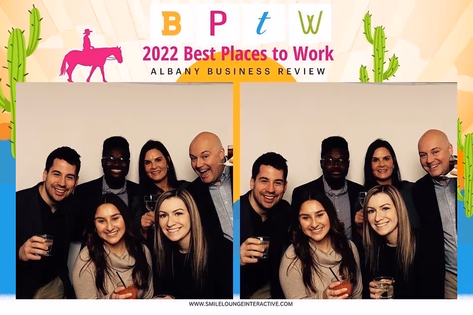 StoredTech staff in photobooth at best places to work ceremony.