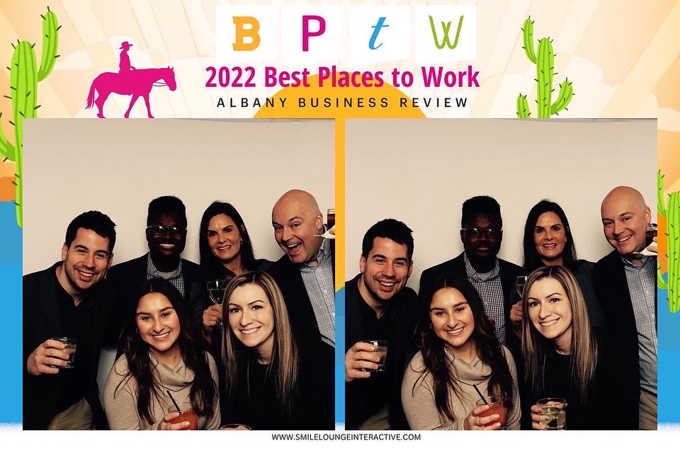 StoredTech staff in photobooth at best places to work ceremony.