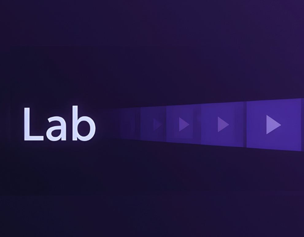 The word 'Lab' illuminated on the left side with a series of translucent play buttons fading into the background on a dark purple gradient.