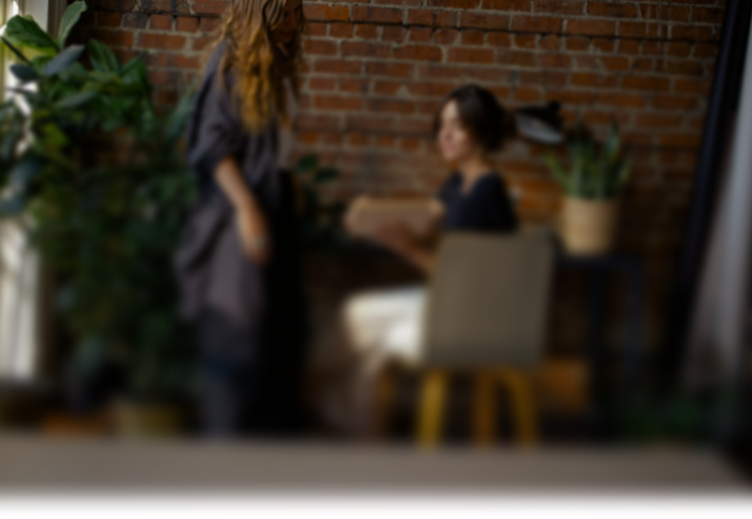 Professional financial advisor reviewing documents with client