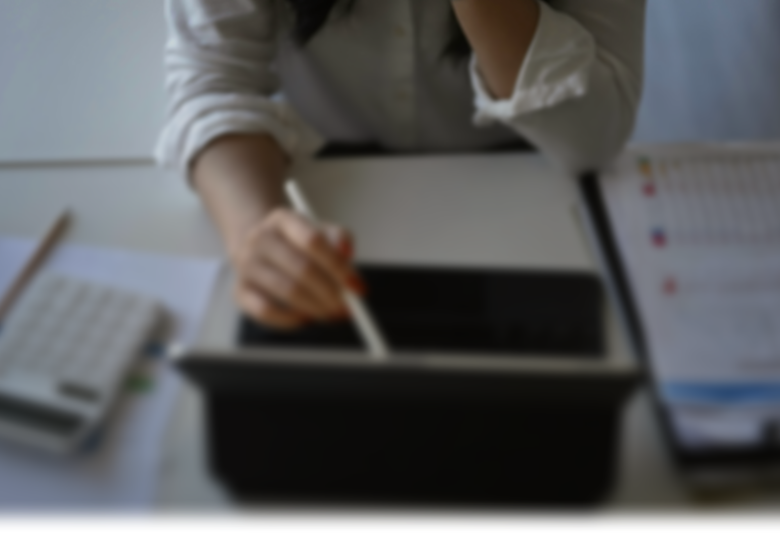 Professional financial advisor reviewing documents with client