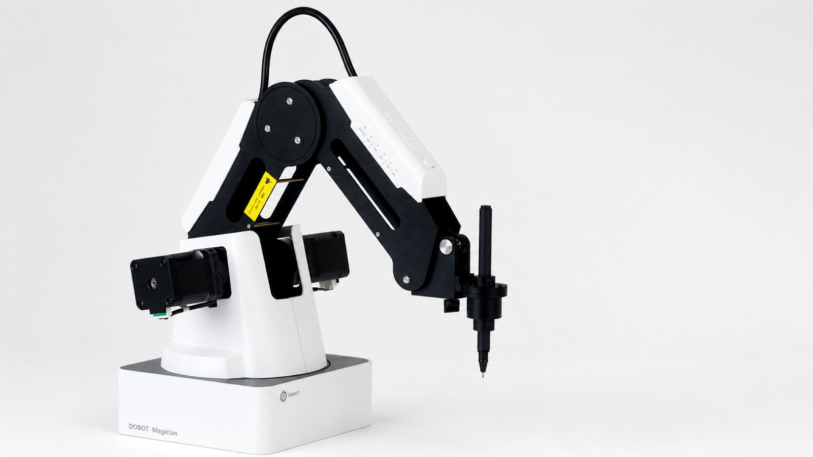 White and black robot arm holding a pen.
