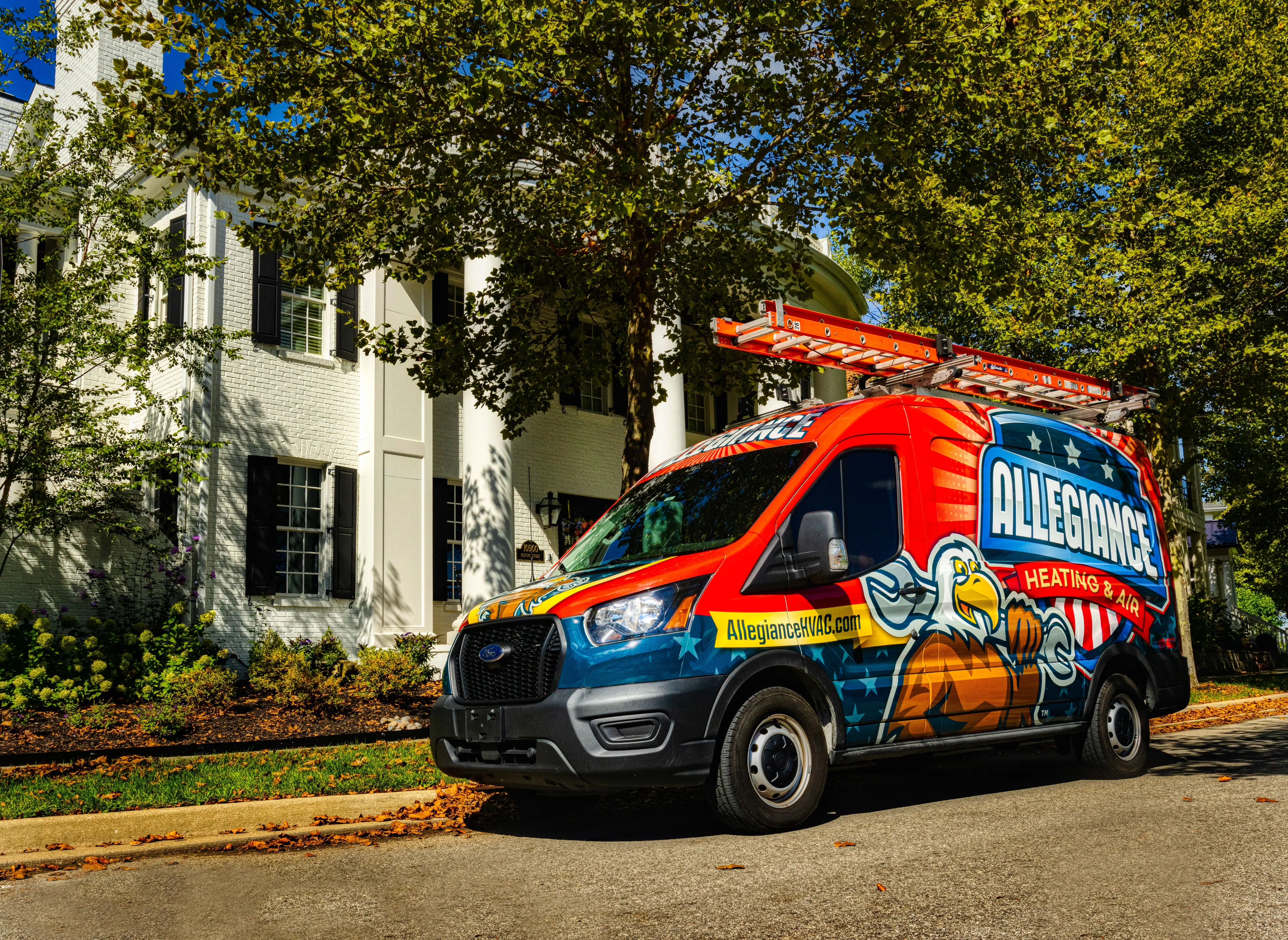 A colorful van with "Allegiance Heating & Air" branding, featuring an eagle