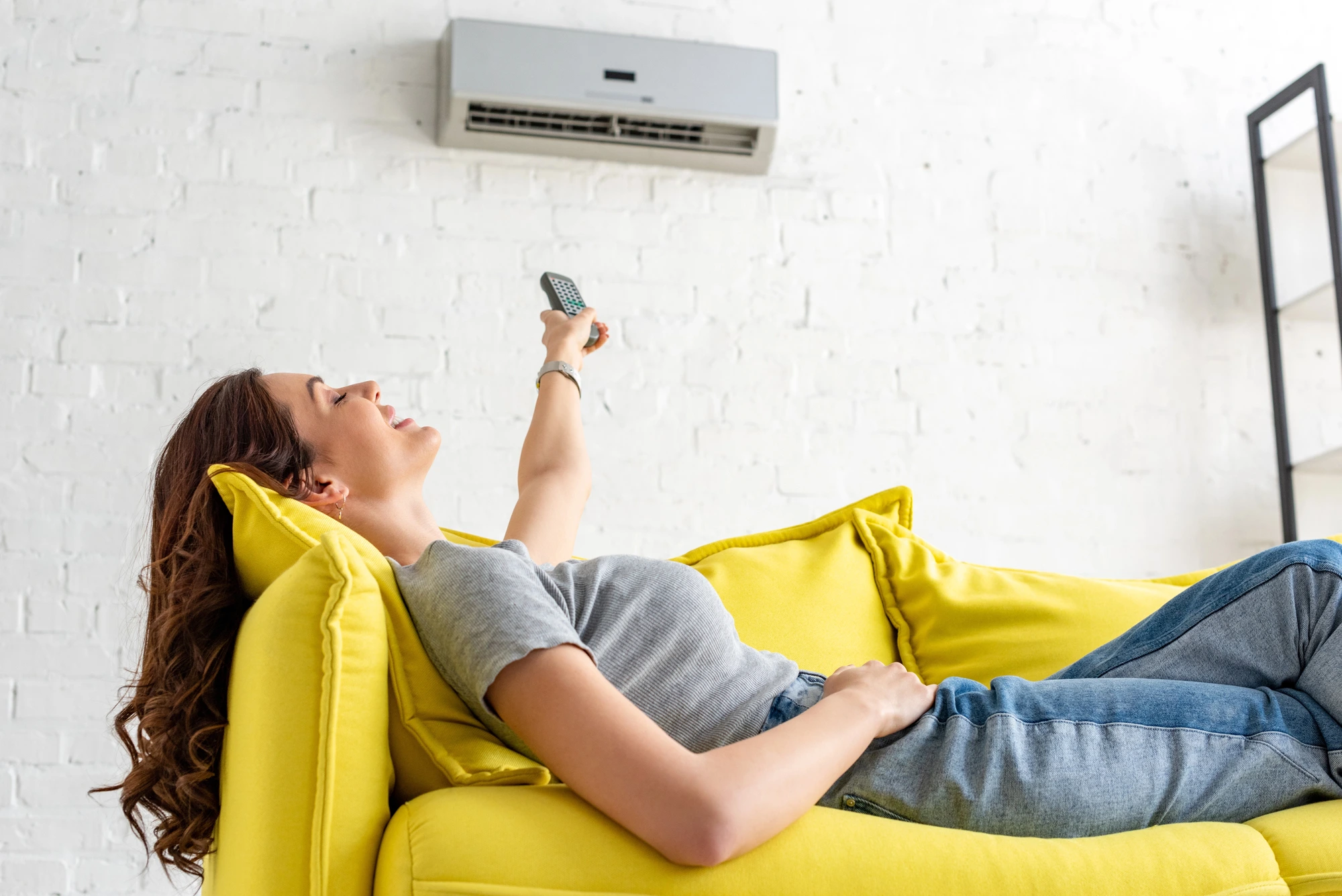 happy woman due to a HVAC maintenance plan