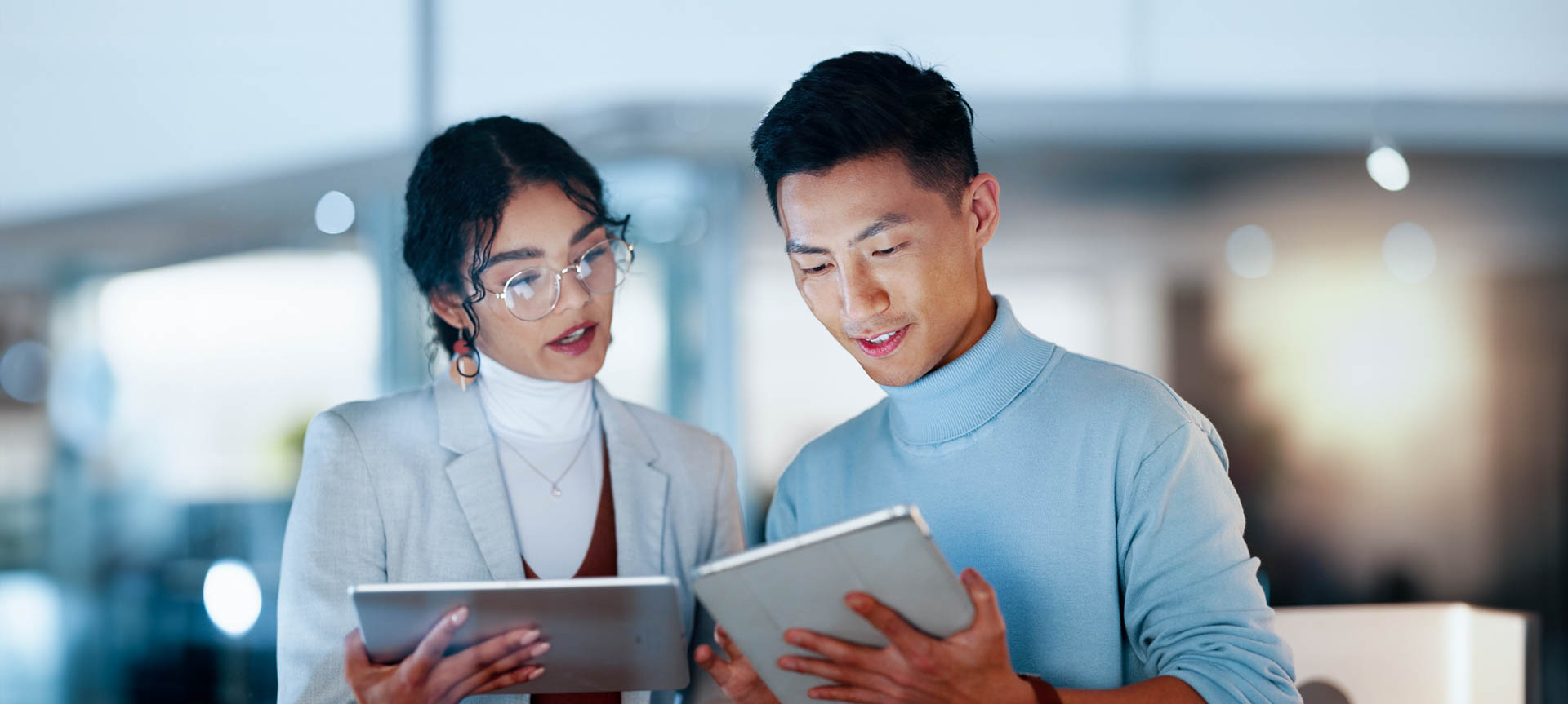 two people working on tablets
