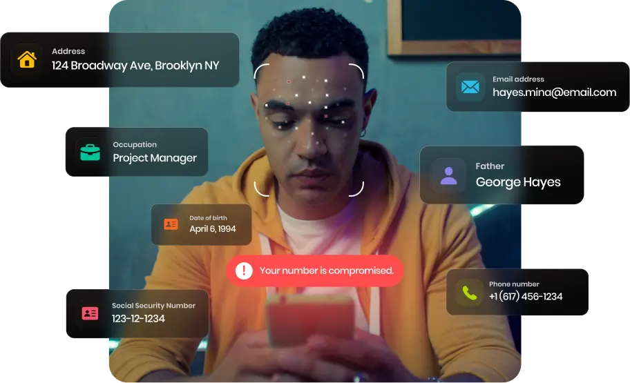 Man in a yellow hoodie looking at his smartphone with overlaid digital identity info including address, occupation, birthdate, SSN, email, father's name, and phone number with a warning that the phone number is compromised.