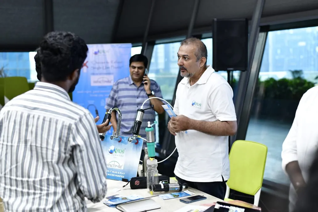 Startup founder demonstrating a product to visitors at T-Hub