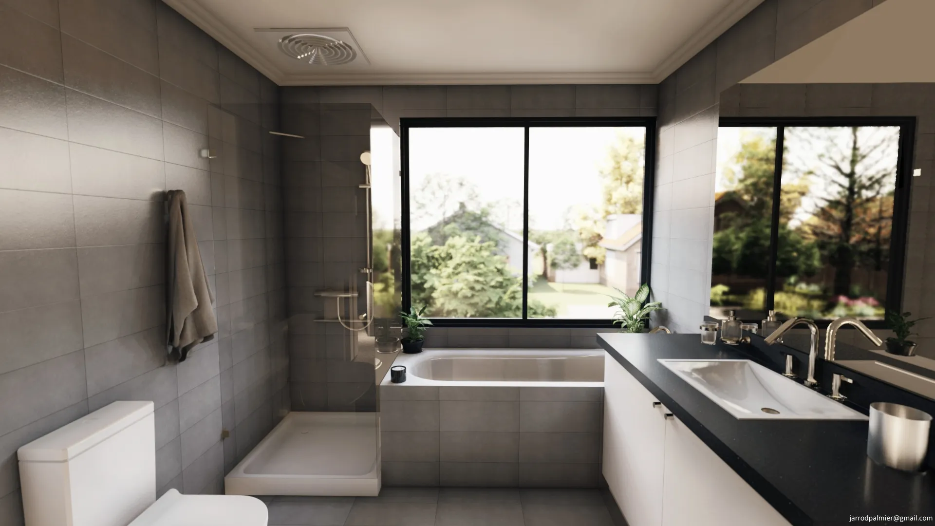 Modern bathroom with gray tiles, a white bathtub under a large window, a glass shower enclosure, white sink with black countertop, and a toilet.