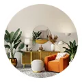 Cozy living room with an orange sofa, white ottoman, green plants, wooden shelf, and a round mirror.