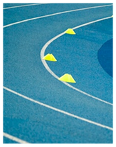 Blue running track curve with three yellow triangular markers placed on the inner lane.
