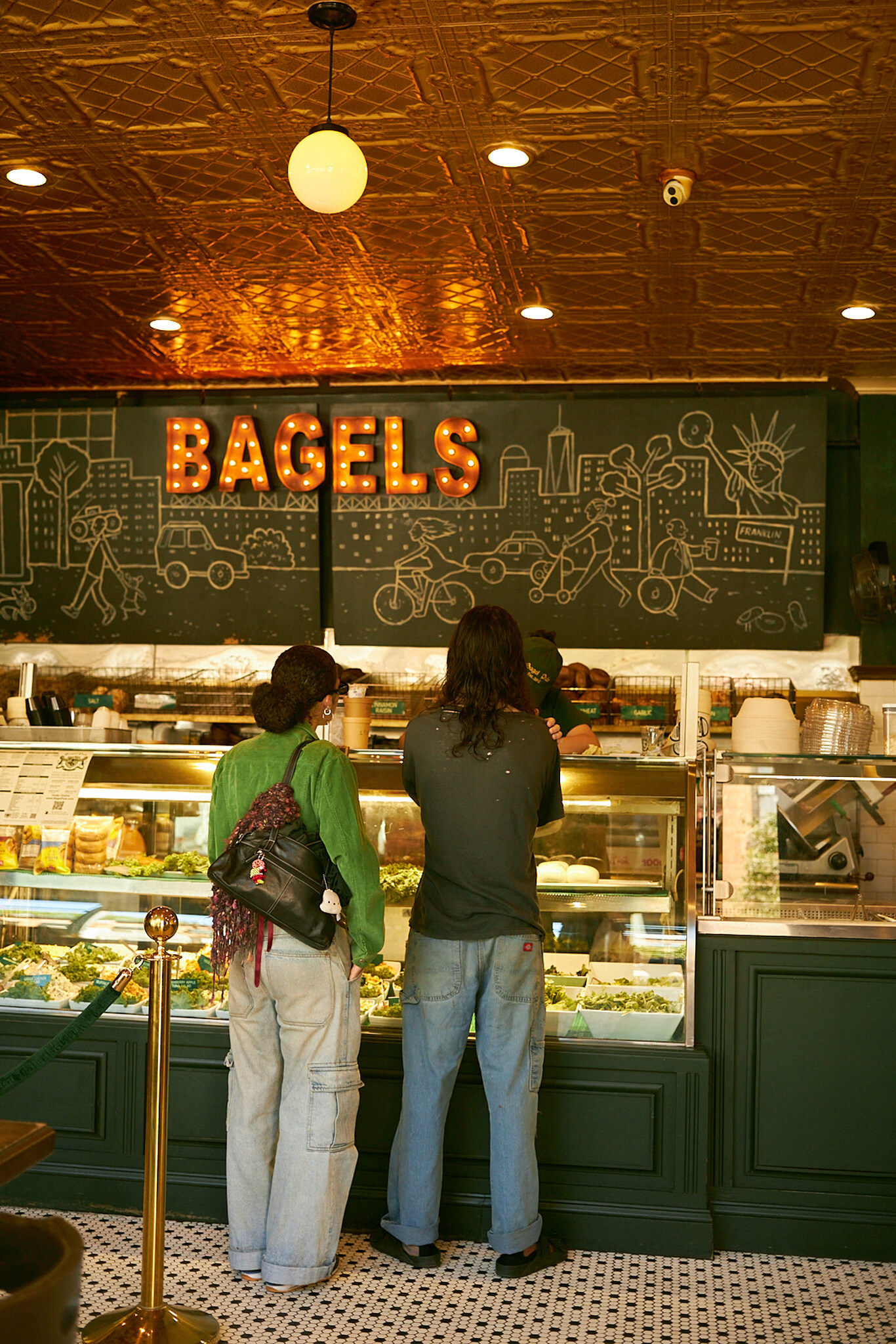 Two customers choosing an order at Bagel Pub and Crown Heights, Brooklyn
