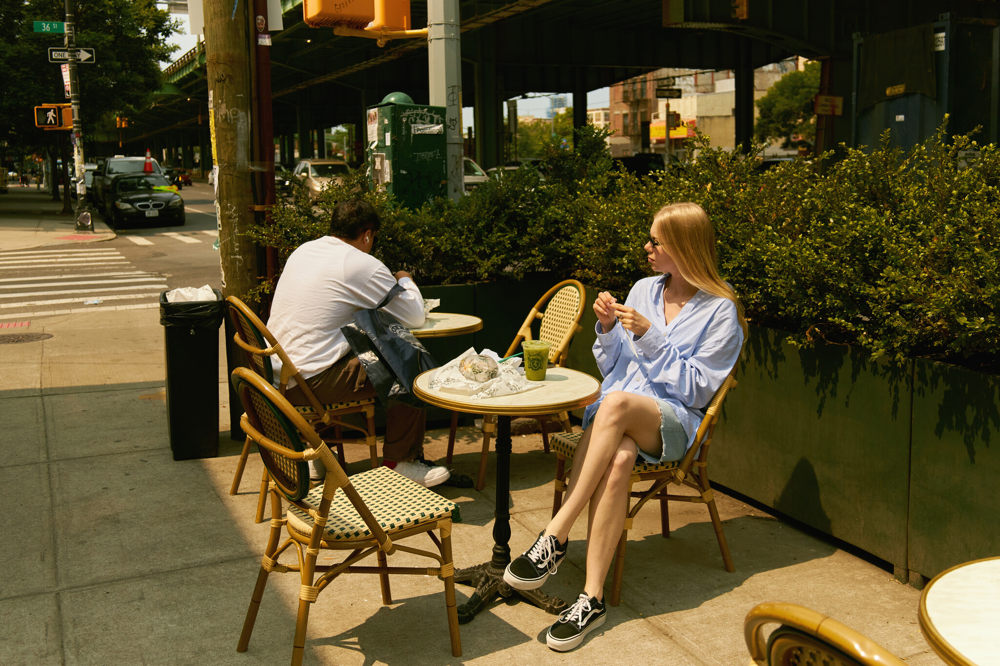 a sunny outside seating area at the Bagel Pub at Sunset Park