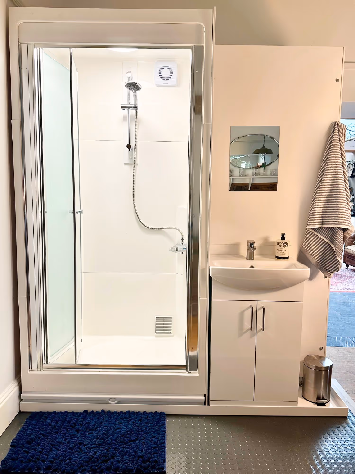 The TRU internal bathroom with shower, sink and mirror