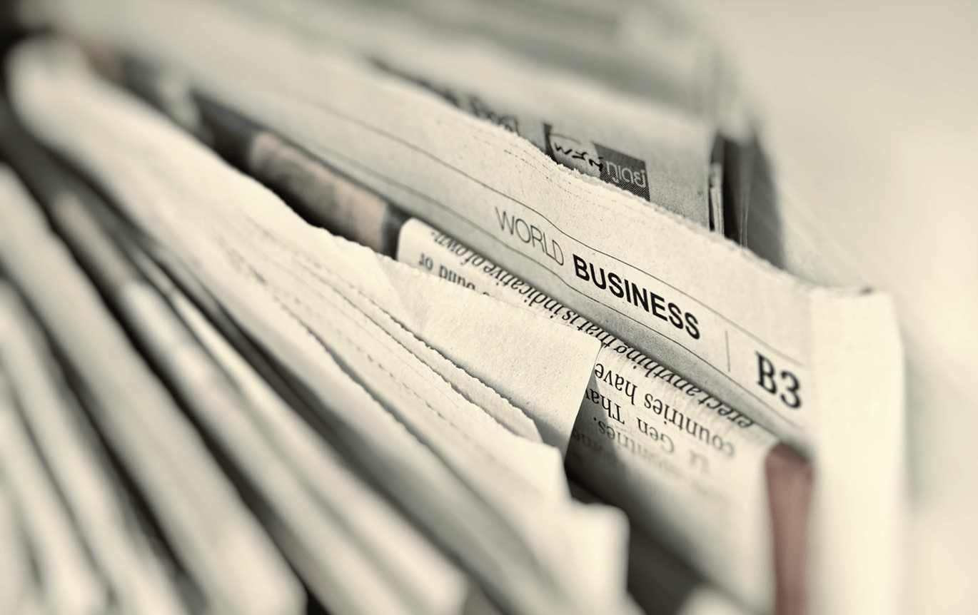 A stack of vertical newspapers