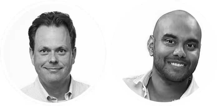 Headshots of two men smiling, one with dark hair and the other bald, both wearing collared shirts.