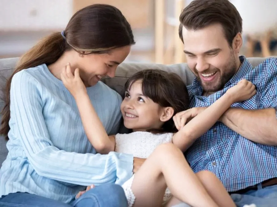 happy smiling family on couch