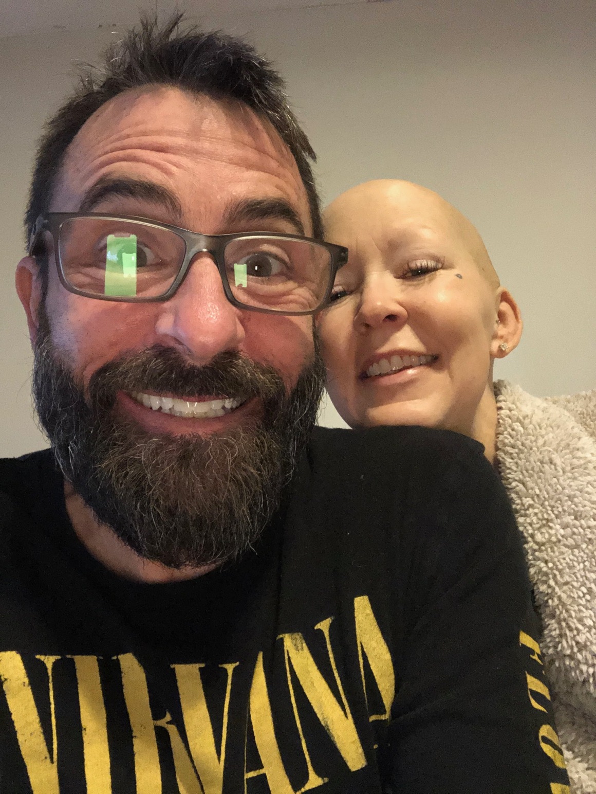 Jana Van Dyck and her husband smiling together