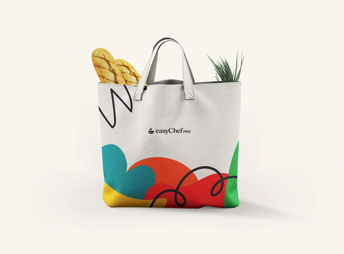 Reusable grocery bag with EasyChef Pro logo and vibrant abstract patterns.