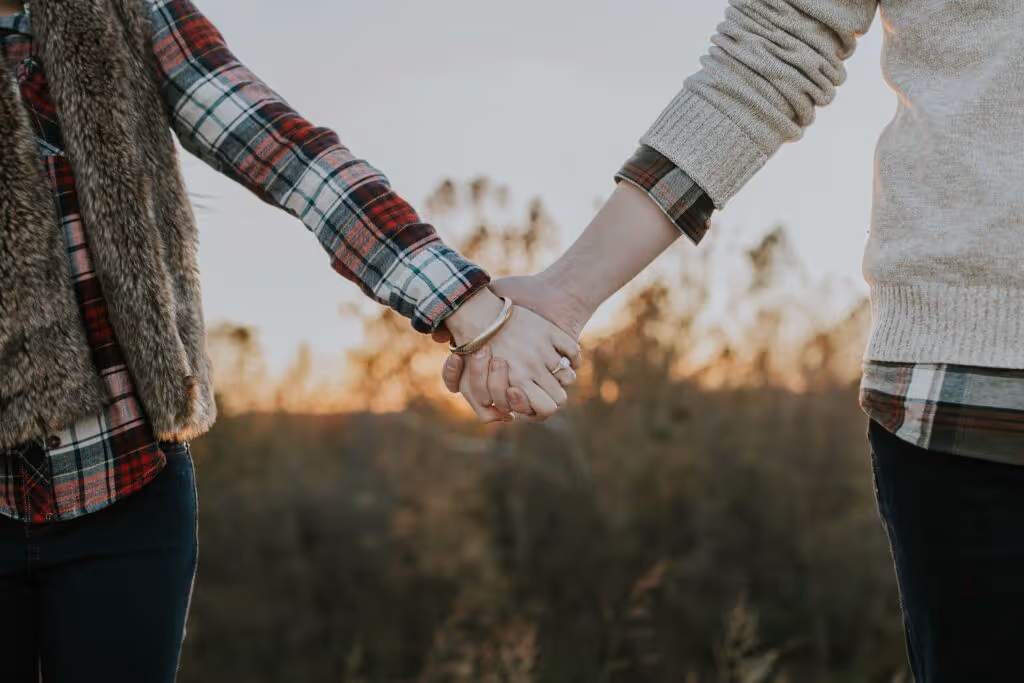 Hand holding couple
