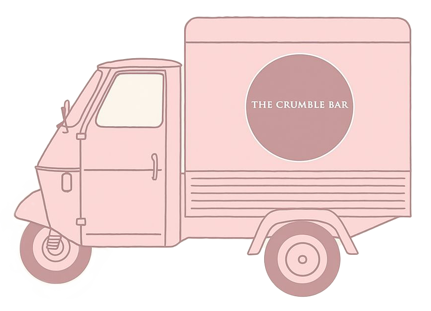A little pink truck, looking to the left side. The Logo of The Crumble Bar Hamburg is visible.
