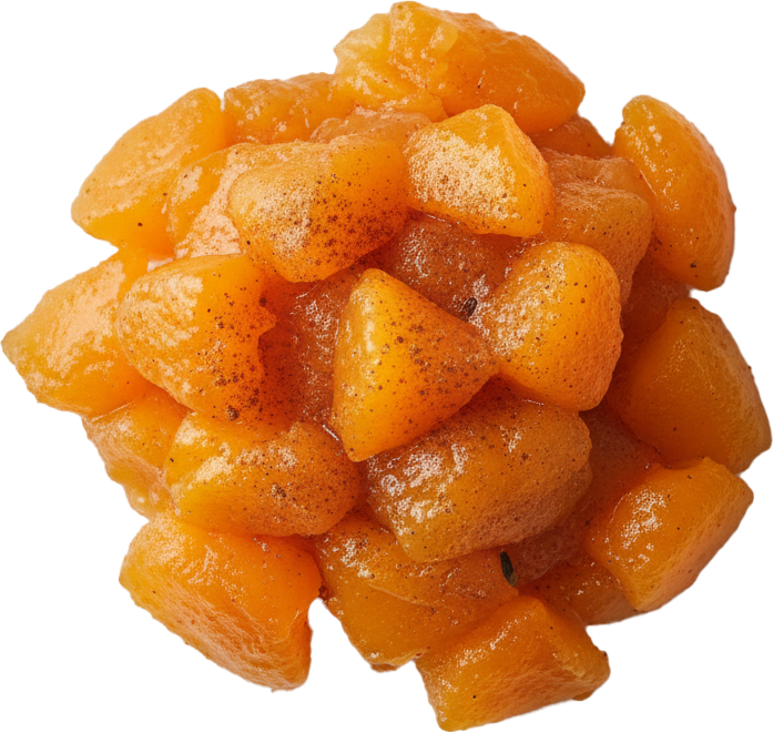Close-up of glossy orange apricot compote pieces sprinkled with brown spice on a white plate.