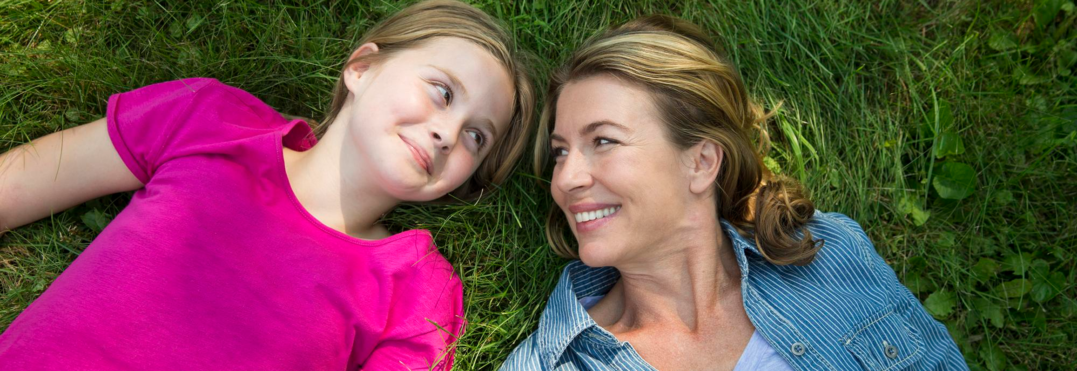Mother and daughter smiling at each other