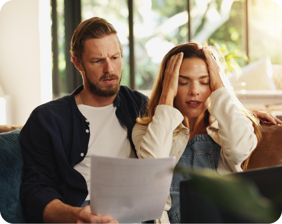 Couple discussing something while sitting on sofa